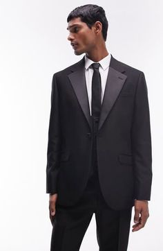 A skinny fit enhances the contemporary appeal of this tuxedo jacket classically detailed with contrast lapels. 30 1/2" length (size 42r) One-button closure Notched lapels Nonfunctional four-button cuffs Chest welt pocket; front flap pockets Partially lined 77% polyester, 17% viscose, 6% elastane Machine wash, line dry Imported Classic Tuxedo With Lapel Collar For Black Tie, Classic Black Tie Tuxedo With Lapel Collar, Notch Lapel Single Button Blazer For Black Tie, Black Tie Single Button Blazer With Notch Lapel, Single Button Notch Lapel Blazer For Black Tie, Tuxedo Blazer With Hidden Button Closure For Black Tie, Black Tie Tuxedo Blazer With Hidden Button Closure, Tuxedo With Hidden Button Closure And Notch Lapel, Black Tie Tuxedo Blazer With Notch Lapel