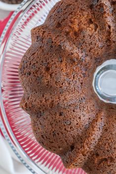 there is a cake on the glass plate