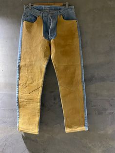 "Crazy good vintage Levi's Photos of inside tag so you can further research I believe they are about 1987 501 style with tan leather fronts Photos of a few stains I feel can be take Out easily at a trusted cleaner. Measurements: Levi's 17 \" across waist 30.5 length inseam  36 x 32" Leather Chaps, Western Stuff, Levis Vintage Clothing, Men's Bottoms, Leather Jeans, Levis 501, Levi Strauss, Vintage Levis, Vintage Denim