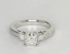 a princess cut diamond engagement ring with side stones