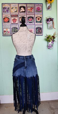 Gloria Vanderbilt, Blue Denim Upcycled Lace, Ribbon, Unique One of A Kind, Festival, Event, Costume, Skirt This upcycled lace skirt is made from a cut off pair of women's Gloria Vanderbilt, size 12, blue denim jeans. I added blue vintage lace, various trims, rick-rack, bias tape, satin and lace ribbon, blue, silver bali beads and buttons. The back pockets came decorated. I have collected it all from various places. I did hem the vintage bugle bead ribbon.  The waist measures approx. 33 inches around, with only a small amount of stretch, the zipper and pockets are functional. The longest lace ribbons measure approx. 35 inches including the denim. Ready to be cut to the length you desire. If you trim , you might want to re-hem the ribbons with the bugle beads along it side.  Each of the piec Blue Recycled Denim Skirt For Spring, Spring Blue Recycled Denim Skirt, Blue Stretch Skirt With Frayed Hem, Blue Recycled Denim Skirt For Summer, Blue Bohemian Bottoms With Frayed Hem, Bohemian Blue Bottoms With Frayed Hem, Summer Blue Recycled Denim Skirt, Fitted Upcycled Denim Bottoms, Upcycled Blue Bottoms For Spring