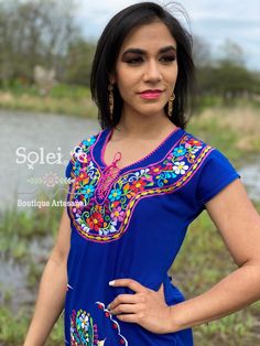 This gorgeous Kimono dress is an original design from Puebla, Mexico. This dress has ties on the back in order to adjust the fit. Boasting a floral design of colors, you will look beautiful for any occasion. The earrings you can buy too and find here. https://www.etsy.com/es/listing/637147293/filigrana-redonda-filigrana-clasica?ref=shop_home_active_4&pro=1&frs=1 Fitted Embroidered Short Sleeve Dress For Festival, Fitted Short Sleeve Embroidered Dress For Festivals, Fitted Embroidered Dress With Short Sleeves, Fitted Embroidered Short Sleeve Beach Dress, Fitted Embroidered Short Sleeve Dress For Beach, Fitted Short Sleeve Embroidered Dress For Beach, Fitted Short Sleeve Embroidered Beach Dress, Fitted Blue Embroidered Dress With Short Sleeves, Blue Fitted Embroidered Dress With Short Sleeves