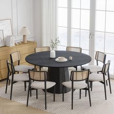 a round table with six chairs around it