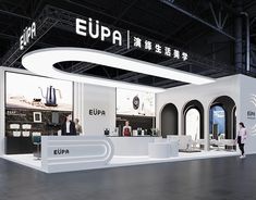 an exhibition stand with people standing around it and the words eupa on the wall