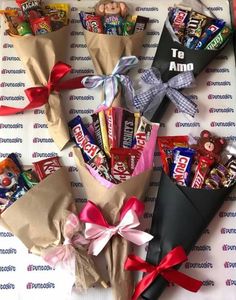 candy bouquets wrapped in brown paper and tied with red ribbon