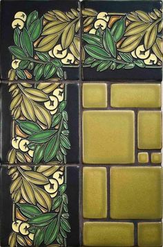 an artistic tile design with green leaves and flowers