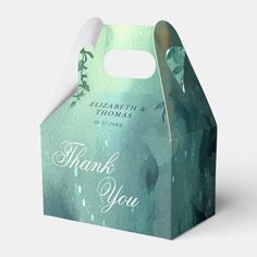 a green and white thank you gift bag with leaves on the front, in an abstract pattern