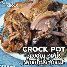 crock pot savory pork shoulder roast on a blue and white plate