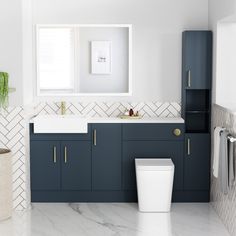 a bathroom with blue cabinets and white walls