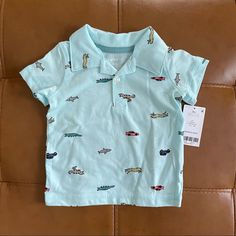 Nwt Carters Baby Boy Printed Blue Polo Shirt Cute Blue Collared Top, Playful Fitted Blue T-shirt, Cute Light Blue Tops For Playtime, Cute Collared Tops For Playtime, Playful Collared Blue Tops, Cute Collared Tops For Play, Playful Blue Collared Top, Cute Fitted Blue Shirt, Light Blue Fitted Tops For Playwear