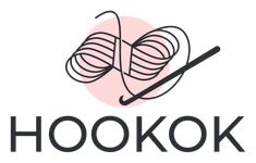 the hook logo with yarn and knitting needles in front of it on a white background