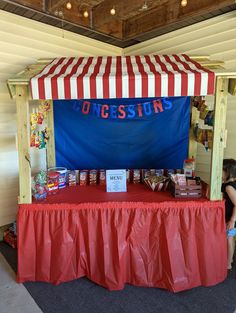 a red and white striped tent with food on it