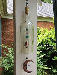 a wine bottle hanging from the side of a building with a crescent and stars on it