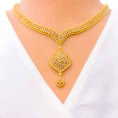 The Glistening Upscale 22k Gold Kundan Necklace Set, weighing 58.9 grams, is a symbol of luxurious elegance. Crafted with 22k gold, it boasts a luminous yellow gold finish that perfectly accentuates the richly set Kundan stones. The necklace is 16 inches long, featuring a 1.75-inch drop and 1.8-inch adjustable links for a tailored fit. A secure hook lock ensures ease of wear. Complementing the set are matching earrings, each 1.75 inches in length, with screw-back posts for secure fitting. Ideal Hallmarked Yellow Gold Kundan Necklace, Hand Set Yellow Gold-plated Kundan Necklace, Festival Yellow Gold Kundan Necklace, Elegant Yellow Gold Kundan Necklace For Rituals, Spiritual 22k Gold Kundan Necklace, Kundan Necklaces, 22k Gold, Gold Finish, Matching Earrings