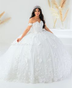 Look like a fairy-tale princess in this long off shoulder sweetheart neckline A-line dress with 3D floral tulle ball gown skirt. This glamorous off shoulder ball gown beautifully accented with 3D floral appliques blooming across the bodice. A sweetheart neckline tops the full tulle skirt accented with pearl and sequined embellishments. This dress is finished with a lace-up back with long royal train. House of Wu Quinceanera Collection Fall 2022 Style Number: 26024 Fabric: 3D Floral/Pearls Sparkl Floral Quinceanera Dress, White Quince Dress, Dress For Quinceanera, White Quince Dresses, Quince Dresses White, Train House, White Quince, Quincenera Dresses, Quinceanera Collection