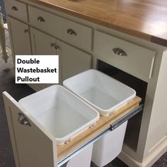 double wastebasket pullout in the middle of a kitchen