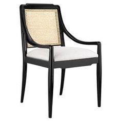 an upholstered chair with cane back and armrests in black wood, white fabric