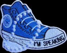 a blue sneaker with the words i'm speaking on it is embroidered onto a black background