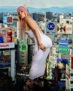 a pregnant woman standing on top of a building in a city with lots of billboards