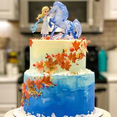 there is a blue and white cake with an image of a horse on top of it