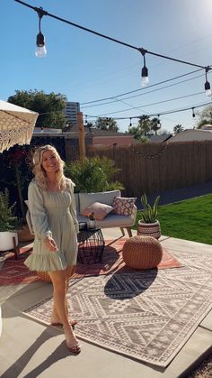 a woman standing on top of a patio