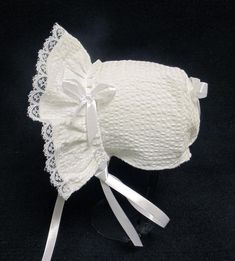 New handmade white puffy searsucker baby bonnet * white puffy searsucker fabric * White  lining * White lace * White 3/8 inch double sided satin ribbon bows and ties Size/ measurement from under ear lobe around top of head to under other ear lobe preemie / 10 inches 0-3 months / 11 inches 3-6 months / 12 inches 6-9 months / 13 inches 9-12 months / 14 inches White Adjustable Lace Bonnet, White Lace Adjustable Bonnet, White Cotton Bonnet For Baptism, Satin Ribbon Bow, Baby Bonnet, Rising Sun, Ribbon Bows, Satin Ribbon, Sun Hats