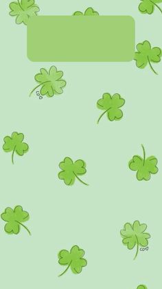 four leaf clovers flying in the air with a green banner above them that says luck