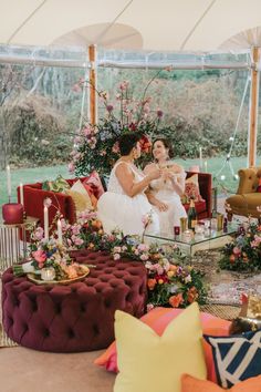 the bride and groom are sharing a moment together in their marquee wedding ceremony