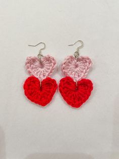 "These cute & flirty dangle heart earrings are the perfect accessory for Valentine's Day or a statement piece for everyday wear.  DETAILS: This item is handmade  Materials: Acrylic Yarn, iron ear hooks Size: approx. L 3\" x W 1.5\"  📦 Free Shipping on US orders of $35+ ❤️ If you have any questions, please feel free to send me a message ❤️ Follow us on Instagram & TikTok @tintin_designco for store updates and discounts PLEASE NOTE THAT DUE TO THE HANDMADE NATURE OF THESE ITEMS, WE DO NOT ACCEPT RETURNS. HOWEVER, IF THERE IS A PROBLEM WITH YOUR ORDER, PLEASE MESSAGE ME." Handmade Cute Double Heart Earrings, Handmade Double Heart Cute Earrings, Cute Dangle Earrings For Valentine's Day, Handmade Double Heart Earrings, Cute Style, Valentine's Day Heart Earrings With Ear Wire, Trendy Double Heart Earrings For Valentine's Day, Red Dangle Heart Earrings, Trendy Red Dangle Heart Earrings, Handmade Heart Drop Earrings For Valentine's Day