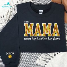 🎄 Holiday Shipping Reminder 🎄 Place your order by December 7, 2024 to ensure delivery before Christmas.❤️ This embroidered sweatshirt features "Softball Mama" on the front and can be customized with your kid's names on the sleeve. It's a fashionable and unique way for sports moms to show their support and pride. Ideal for Mother's Day, this personalized sweatshirt is a thoughtful gift that celebrates her role as a supportive sports mom. Combining comfort with a custom touch, it's a cherished p Team Spirit Sweatshirt With Letter Embroidery For Sports Events, Sporty Black Embroidered Sweatshirt, Cotton Sweatshirt With Embroidered Logo For Sports, Team Spirit Long Sleeve Sweatshirt With Custom Embroidery, Sports Sweatshirt With Letter Embroidery In Cotton, Sports Cotton Sweatshirt With Embroidered Graphics, Cotton Sports Sweatshirt With Letter Embroidery, Cotton Sports Sweatshirt With Embroidered Graphics, Cotton Sweatshirt With Letter Embroidery For Sports