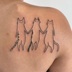 three cats holding hands tattoo on the shoulder