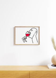 a drawing of a person drinking from a wine glass in front of a white wall