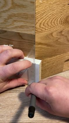 a person is working on a piece of wood