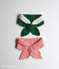 two crocheted bows on top of each other, one pink and one green