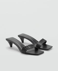 in stock Chic Summer Mules With Tang Buckle, Black Low Heel Mules With Buckle Closure, Sleek Summer Heels With Buckle Closure, Chic Open Toe Mules With Tang Buckle, Black Tang Buckle Sandals For Summer, Leather Sandals With Sculpted Heel For Night Out, Sleek Leather Sandals With Heel Loop, Low Heel Leather Sandals For Night Out, Sleek Open Toe Sandals With Buckle Closure