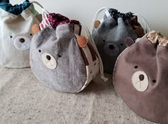 three small bags with bears on them are sitting on a table next to each other