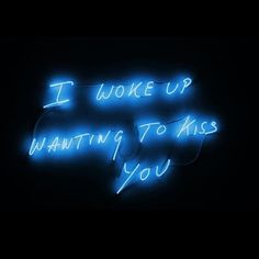 a neon sign that says i woke up wanting to kiss you