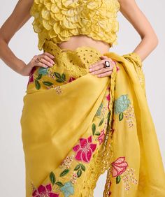 Drape yourself in elegance with this yellow silk organza sari, adorned with intricate floral applique, delicate threadwork, captivating beadwork, and exquisite cutwork. This ensemble embodies sophistication and charm, perfect for making a memorable statement at any special occasion. Organza Sari, Indian Dress Up, Buy Designer Sarees Online, Indian Kurti Designs, Indian Wedding Outfit, Traditional Blouse Designs, Fancy Sarees Party Wear, Designer Sarees Online, Pakistani Bridal Dresses