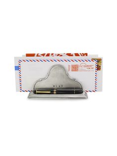 an envelope with a pen in it and some mail on the back side, as well as a clipboard for writing