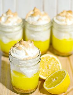 there are lemons and whipped cream in mason jars