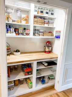 an open pantry with lots of food in it