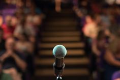 a microphone that is sitting in front of some stairs