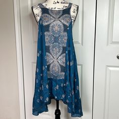 Blue Bohemian Mini Dress With Lace Trim, Bohemian Blue Mini Dress With Lace Trim, Flowy Sleeveless Boho Dress In Rayon, Flowy Sleeveless Rayon Boho Dress, Blue Rayon Sundress, Blue Bohemian Mini Dress Knee-length, Blue Flowy Tunic Boho Dress, Blue Bohemian Knee-length Mini Dress, Blue Bohemian Sleeveless Mini Dress