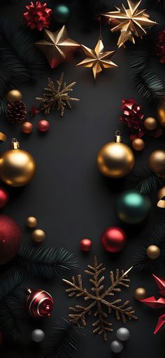 christmas ornaments arranged on a black background with gold, red and green decorations around them