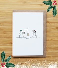 a christmas card with two snowmen holding a fishing rod