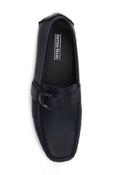 A silver-tone buckle details the vamp of this loafer crafted from textured faux leather. Moc toe Slip-on style Synthetic upper/rubber sole Imported Formal Flat Loafers With Buckle Closure, Business Loafers With Buckle Closure And Slip-on Design, Formal Loafers With Buckle Closure, Flat Loafers With Buckle Closure For Office, Business Loafers With Buckle Closure And Closed Toe, The Vamp, The Vamps, Moccasins, Nordstrom Rack