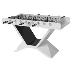 a white foosball table with black and silver knobs on the top, in front of a white background