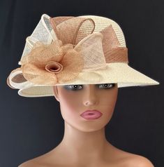 This hat is a very elegant and sophisticated ivory colored straw hat. A beautiful design featuring Sinamay flowers and leaves in light tan,ivory, beige and white  This creation is a perfect hat for church or for the Kentucky Derby. Stunning for a wedding party or tea party. Amazing hat for special occasions. You will love it! Brim: 3" Rise: 4" Size: Internal Draw String to adjust to any size head