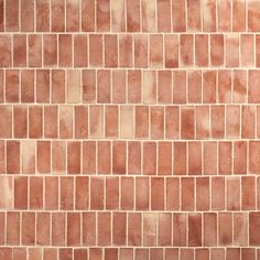 a red brick wall that is very close to the ground