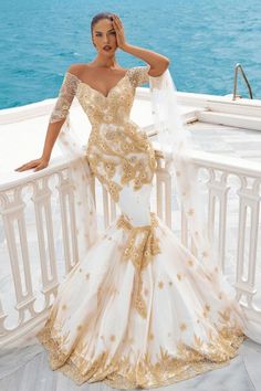 Ballbella offers Mermaid Bridal Gowns Gold Appliques Half Sleeve Cape at a good price, 1000+ options, fast delivery worldwide. Gold Lace Wedding Dress, Gold And White Wedding, Gold Wedding Gowns, Gold Applique, Gown Gold, Bridal Gowns Mermaid, Wedding Gowns Mermaid, Lace Mermaid, Lace Mermaid Wedding Dress